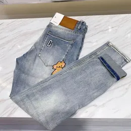 Jeans da uomo firmati Alfabeto ricamato Jeans Cartoon Kitten Pantaloni europei elasticizzati coreani da uomo slim fit