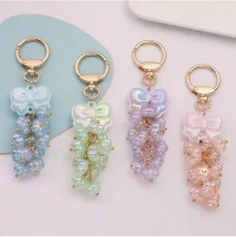 سلاسل المفاتيح الإبداعية Bowknot Beaded Heads Case Airpods Car Car Ring Ring Electroplating Flegkin Lantern Bag bag keyring