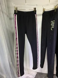 Leggings da donna addensare in pile pantaloni che toccano il fondo delle donne 2023 autunno inverno lettere di perforazione stretch skinny nero taglie forti M-4XL