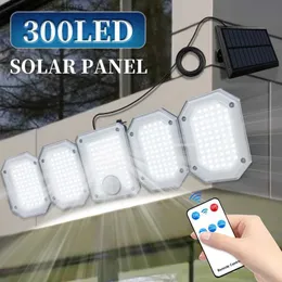 Solar Wall Lights LED Solar Light Outdoor 300LEDS 5 głowic Super jasny czujnik ruchu Lampa słoneczna Podzielona lampa ścienna IP65 z zdalnym 4 trybem roboczym Q231109
