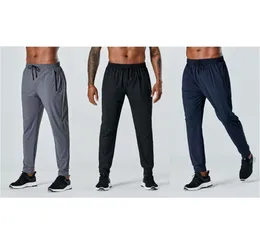 Zipper Yoga Fly Long Pants Mężczyźni Kieszenie na siłowni na świeżym powietrzu Slim Sports Fitness Dresspants spodni jogger9004921