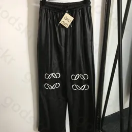 Pantaloni a gamba larga in PU con ricamo Pantaloni a vita alta stile street da donna Pantaloni a vita elastica alla moda