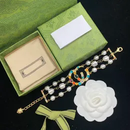 2023 Nuova lettera G Colore perla Catena di diamanti Temperamento Designer retrò per la moda femminile Splendido marchio Celebrity Stesso braccialetto