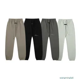 Diseñador de hombres Ess Pantalones de niebla Elasticidad reflectante Deportes Letras de silocona sueltas Pantalones de chándal con cordón Casual ZK14