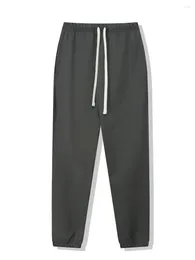 Męskie spodnie jesienne zimowe spodnie dresowe jogger men ciężkie spodnie 550 g bawełniane dresy streetwearne luźne siłownię wysokiej jakości
