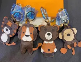 Keychains lanyards Lion Tiger Monkey Bear Luxury Designer Leather Key Chain Laser präglade väskhängen med ruta 1853231e Drop Del Motion Current 63ess