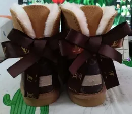 Venda quente AUS design clássico L Bow U botas mulheres neve bowknot manter quente curto inverno couro genuíno pele de carneiro pelúcia UGGsity cor sólida