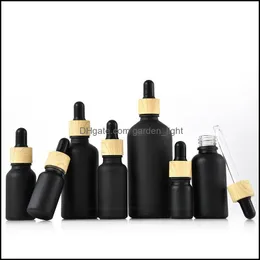 Packing Bottles Matte Black Coated Glass Dropper Bottle Boston Round Essential Oils Per With Wood Grain Plastic Cap Drop Delivery Of Otnsy