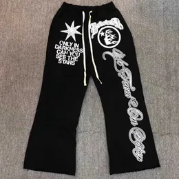 سروال الرجال الأسود Hellstar Sweatpants الكلاسيكية Flame Star رسالة طباعة بنطلون الهيب هوب الأمريكي غير الرسمي رجال فضفاضة للنساء بيل بيلز Cl T231118