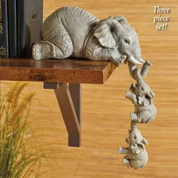 Dekoratif nesneler figürinler 3pcs/set sevimli fil figürinler fil tutma bebek reçine el sanatları ev mobilyası hediye şanslı heykel oturma odası süslemeleri 231120
