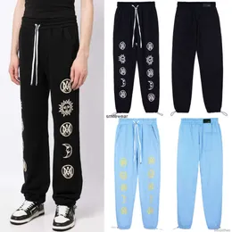 Designers calça casual streetwear calças sweatpants 2023 novos amires high street moda lua sol impressão qualidade calças soltas leggings homens mulheres