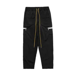 Дизайнерская одежда Повседневные брюки 2021 Новые модные пуговицы в стиле хип-хоп High Street Multi Pocket Zipper Drawstring Rhude Pants Streetwear Jogger Trousers Спортивные штаны