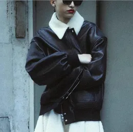 kha*iteレザーコート女性 - 秋/冬の新しいデザインの感触広い取り外し可能な毛皮の襟のゆるい怠zyなジャケット