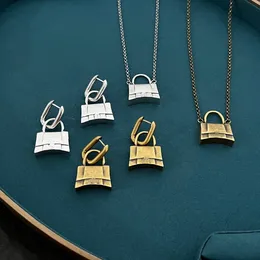 Nytt designad låshänge halsband koppar 18k guldpläterad glänsande metall x bokstäver lyxiga kvinnor män örhängen par designer smycken bb0321