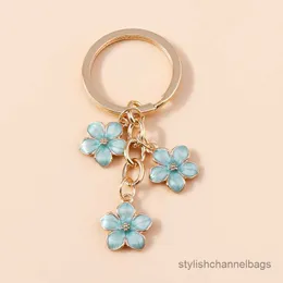 4st Keychains Söt emalj Keychain Färgglada Sakura Flower Key Ring Sweet Key Chains för kvinnor flickor handväska tillbehör smycken gåvor