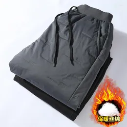 Calças masculinas masculinas de lã quente cargo plus size 5XL soltas pretas de pelúcia térmicas com cordão 2023 calças de moletom esportivas de inverno