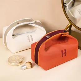 Designer sminkpåsar handväska lyxiga herms totes med avancerad känsla enkel och bärbar förvaring kvinnors nät röda duk tvätt