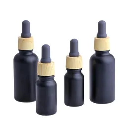 Matte Black Glass e liquid Essential Oil Perfume Bottle with Reagent Pipette Dropper and Wood Grain Cap 10/30ml Mcnqf