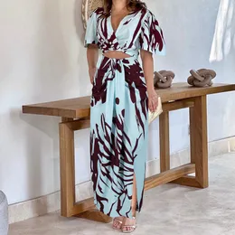Arbetsklänningar Tow Piceses Outfits For Women 2023 Summer Print veckad V-ringning Kort ärm Topp Hög midja Split Fashion Female Maxi kjol