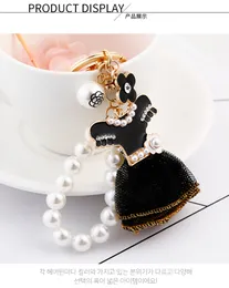 Kreativ svart kjol nyckelringar pärla nyckelkedjor kvinnor väska charm hänge bil nyckeling modeklänning design nyckelring parti gåvor