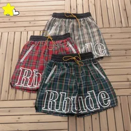 2024 Summer Apricot Green Red Plaid Shorts Män Kvinnor Högkvalitet Löst dragkantar inuti nät