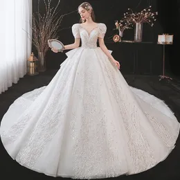 2023 glänsande klänningskulklänningar Bröllopsklänningar Nya prinsessor klänning korsett älskling organza ruffles katedral tåg brudklänning plus storlek skräddarsydd brudklänningar