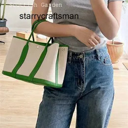 Borsa da giardino in vera pelle per pendolari portatile in tela verde con strato superiore in pelle bovina hardware in acciaio inossidabile logo L