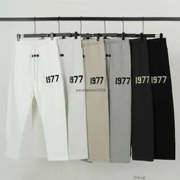 Designer Pantaloni casual Pantaloni da uomo Pantaloni sportivi la versione corretta delle paure Dio Stagione 8 Doppio filo 1977 Lettera floccata Pantaloni da guardia casual Coulisse allentata