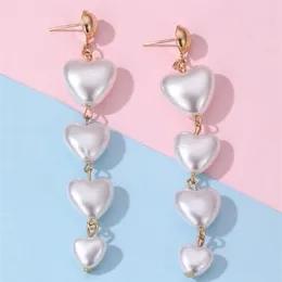 Boucles d'oreilles à clous en forme de cœur d'amour européen et américain pour femmes, bijoux géométriques à la mode, pompon en métal pêche