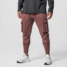 Herrbyxor män joggar sweatpants streetwear byxor mode tryckt muskelsport flera fickor 230131