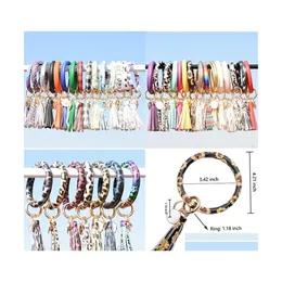 Favor Favor Moda Mulheres Trassels Bracelets Bangle PU Patroce de couro Tecla anel Leopard Lily Print Keychain Sunflower Flag Padr￣o Circl Otvqg