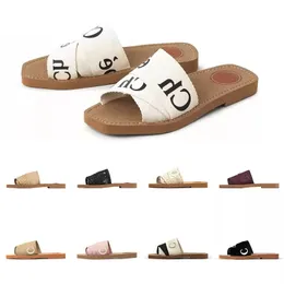 2023 Tofflor Designer Kvinnor Woody Flat Mules Sandaler Slides Segel Canvas Vit Svart Kvinnor Outdoor Beach Slipper skor MÅSTE ha för sommaren