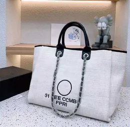 Kvinnor Luxury Handbags OP44 Designer Beach Bag Fashion Knitting Purse Axel Stor tote With Chain Canvas Shopping Bag3fgh