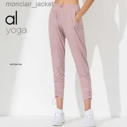 المصمم Alos Yoga Sports Fitness Disual Pants Yoga Pants تقليص الساقين في الجري في الهواء الطلق مع جيوب للنساء