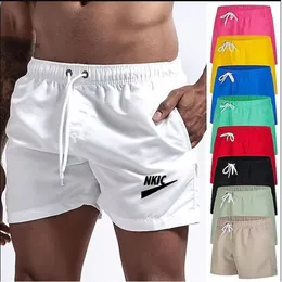 Mäns snabba torr andas shorts ny solid färg som kör sport casual byxor sommar mode shorts varumärke logotyp tryck