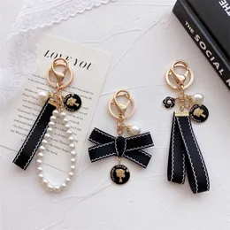 Designer Mode Schlüsselanhänger Luxusmarken Perle handgemachte Schlüsselanhänger Frauen Liebhaber Paar Taschen Autos Schlüsselanhänger Lanyards
