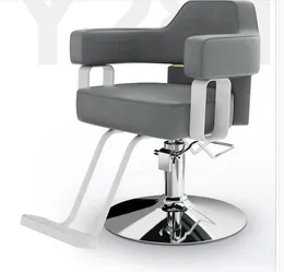 A cadeira do barbeiro na loja do barbeiro pode ser levantada e abaixada. Móveis de salão, cadeira de barbeiro de salão.