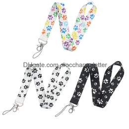 أشرطة الهاتف الخليوي سحر أجزاء الأحذية الملحقات LB2234 الكرتون Dog Paw Print -keychain حبل الشبل للكاميرا الرئيسية شارة معرف الصافرة عقد Otybs