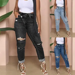 Kvinnors jeans kvinnor 2023 mode casual sexig personlighet rippade sträckknappar nära montering byxa