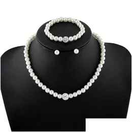 Pulsera Pendientes Collar Venta Elegante Perla Salvaje Diseñador de moda Conjunto de joyas Pulsera para mujer Nupcial Drop Delivery Sets Dhxjo