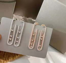 Fode de boucle d'oreille en diamant en mouvement géométrique célèbre V côté étalé d'or 3 pierres boucles d'oreille Shiny aaa zircon move bijoux de bijoux de mariage pour femmes