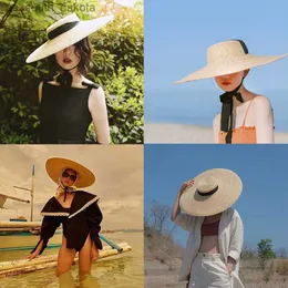 夏のラフィアの女性ロングリボンワイドブリムビーチハットフレンチスタイルビンテージサンスクリーンビッグナチュラル小麦帽子ガールボウキャップL230523