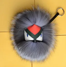 Fluffy Real Fur Pom Poms Bug Little Monster Bag Bag Charm أصلي Pompom Keychain Car Jewelry Pendant3401332