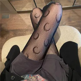 Kvinnliga strumpor svart vit ihåliga månmönstrade fisknät lolita gotiska nät strumpor sexiga tights nyloner ren strumpbyxor damer gåvor