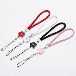 Wholesale 100pcs Creative Weaving Leather Cell Mobile Phone Strap Bracelet Lanyard New Plum Flower Weaving Short Wrist Strap Charms for Girl Women Gift 2023