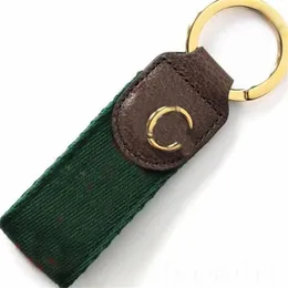 Webbing Designer Keychains Unisex Letter Luxury Keyring Metal Buckle Green Bag Dekorativ bärbar Populär modbil Key Chain Brown Leather PJ055 C23