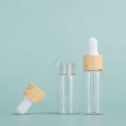 5ml 10ml 15ml 20ml Portable Clear Essential Oil Bottles Glass Empty Dropper Bottle with Plastic Wooden Grain Cap Olkpi