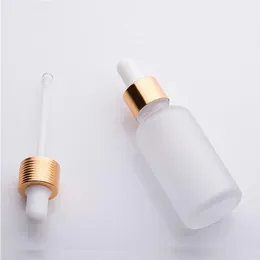 Großhandel 30 ml Milchglas-Tropfflasche leere ätherische Ölflaschen Serum mit Goldsplitter schwarzer Kappe Spssf