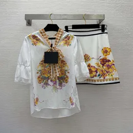 Conjunto de saia 23ss roupas femininas de grife no início da primavera moda flor estampado gola de fita manga babado camisa saia curta conjunto roupas femininas de alta qualidade