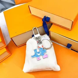 Luxury Designer Couple keyring Cartoon keychains Spring 23 New Puzzle Logo Bag Hanging Decoration Key Chain For Women Men D2306146S